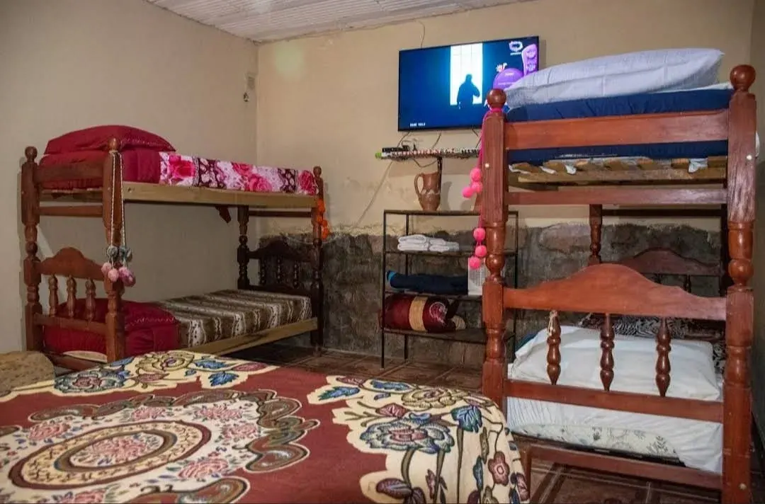 Departamento Inti — dormitorio con ropa de cama de calidad